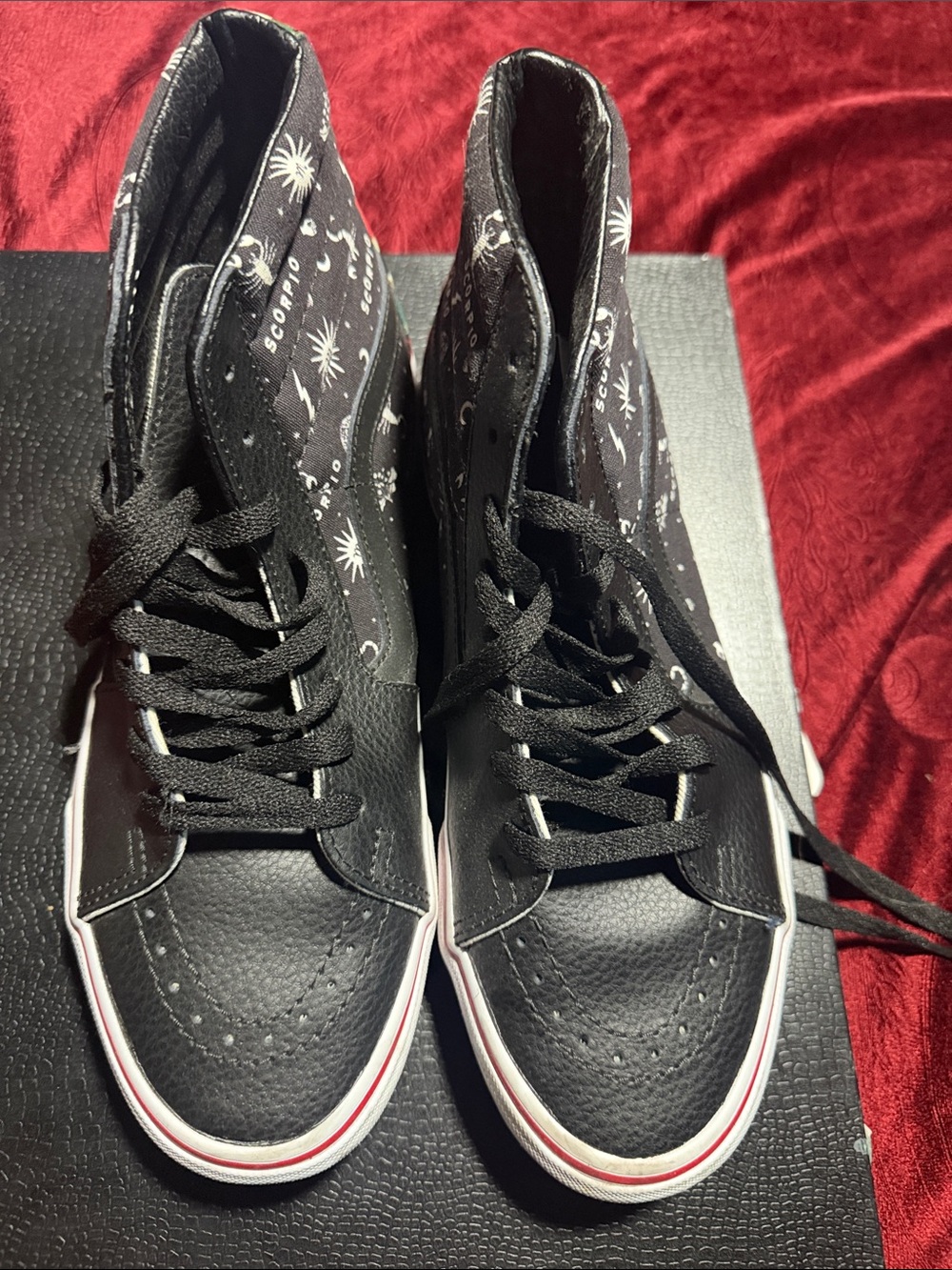 Vans Black High-Top Sneakers with White Accent and Red Stripe